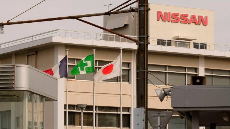 The national flags of France (L) and Japan (R) are displayed at an entrance of Japan’s Nissan Motor’s Oppama plant in Yokosuka, Kanagawa prefecture, on November 26, 2018. AFPPix
