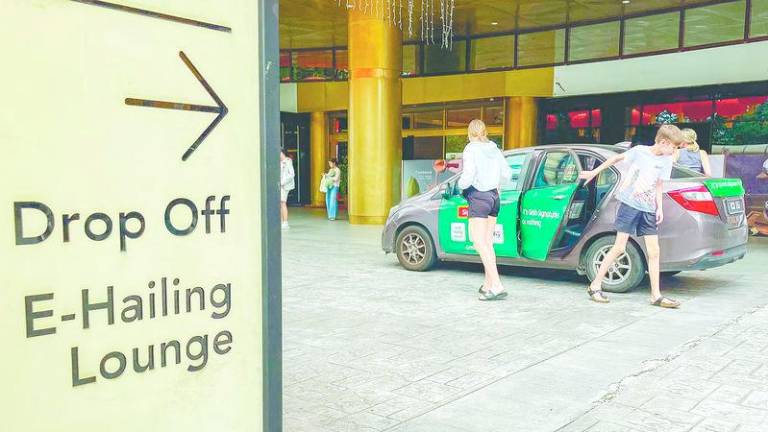 E-hailing drivers have lamented that fare hikes have not translated into better earnings due to the rise in operational costs. – AMIRUL SYAFIQ/THESUN