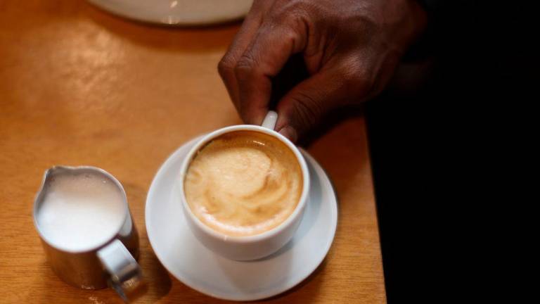 A person takes a coffee at a coffee shop in Rio de Janeiro, Brazil July 10, 2025. REUTERS