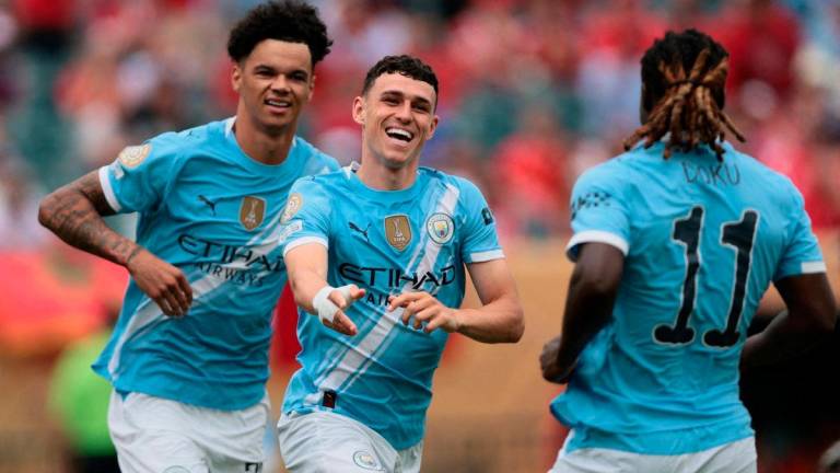 Manchester City’s Phil Foden celebrates scoring their first goal with Nico O’Reilly and Jeremy Doku IMAGN IMAGES via REUTERSpix