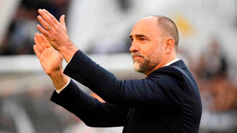 Juventus coach Igor Tudor applauds fans before the match REUTERS