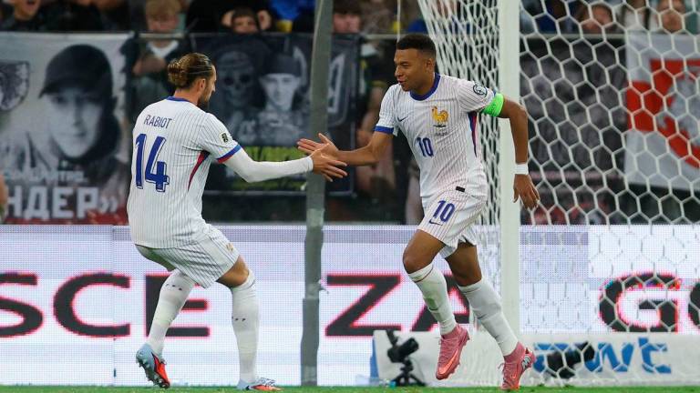 France’s Kylian Mbappe celebrates scoring their second goal with Adrien Rabiot REUTERSPix