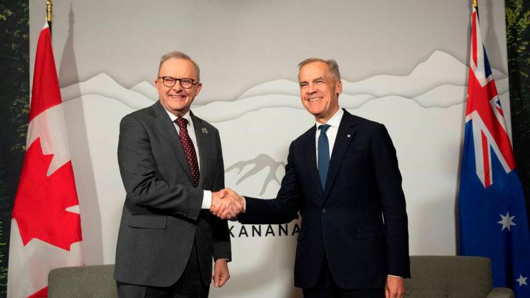 Canadian Prime Minister Mark Carney meets with Australian Prime Minister Anthony Albanese a day before world leaders meet in Kananaskis for the G7 leaders’ summit, in Calgary, Alberta, Canada June 15, 2025. REUTERSpix