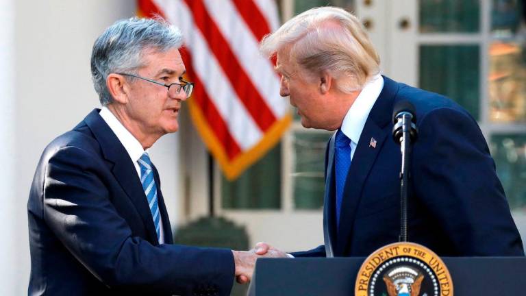 FILE PHOTO: U.S. President Donald Trump arrives shakes hands with Jerome Powell, his nominee to become chairman of the U.S. Federal Reserve at the White House in Washington, U.S., November 2, 2017. REUTERS