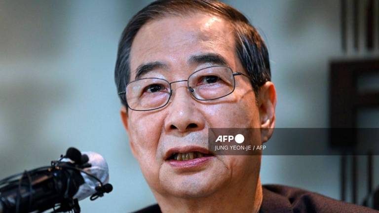 Former South Korean prime minister Han Duck-soo - (Photo by Jung Yeon-je / AFP)