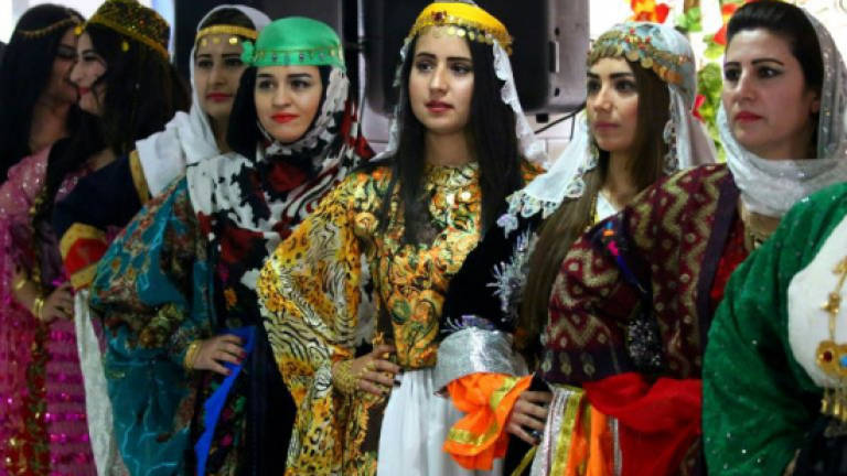 Syria's Kurds hit catwalk to promote traditional attire