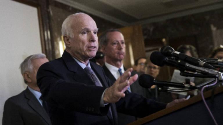 US Senator John McCain to miss key tax vote
