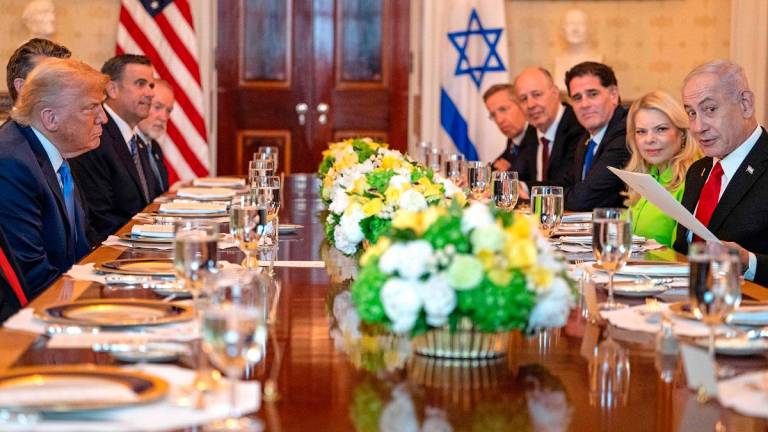 US President Donald Trump meets with Israeli Prime Minister Benjamin Netanyahu at the Blue Room of the White House in Washington, DC, on July 7, 2025. - ANDREW CABALLERO-REYNOLDS / AFP