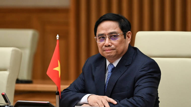 Vietnam’s Prime Minister Pham Minh Chinh attends a meeting with then U.S. Vice President Kamala Harris at the Government office in Hanoi, Vietnam, August 25, 2021. - REUTERS