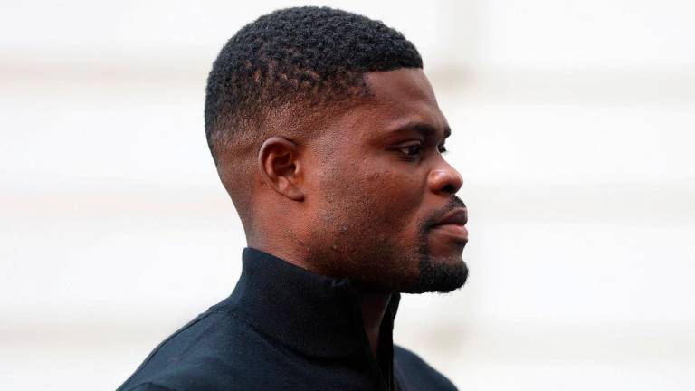 Former Arsenal player Thomas Partey, who has been charged with five counts of rape and one count of sexual assault, walks outside Westminster Magistrates’ Court, in London, Britain, August 5, 2025. - REUTERS/Hannah McKay