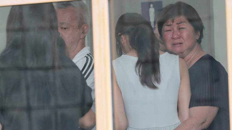 A somber atmosphere enveloped the grounds of the Department of Pathology at University Malaya Medical Centre (UMMC), as the family members of a Form Four female student — who was believed to have been fatally stabbed by a schoolmate in Petaling Jaya — arrived today for the post-mortem process. - BERNAMAPIX