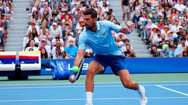 Serbia’s Novak Djokovic in action with Serbia’s Olga Danilovic during their round of 16 mixed doubles match against Russia’s Mirra Andreeva and Russia’s Daniil Medvedev REUTERS/Mike Segar