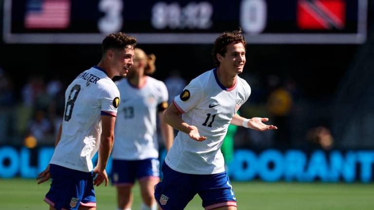 Brenden Aaronson #11 of United States celebrates with Sebastian Berhalter #8 after scoring in the second half against Trinidad and Tobago during the Gold Cup 2025 at PayPal Park on June 15, 2025 in San Jose, California. - Jed Jacobsohn/Getty Images/AFP