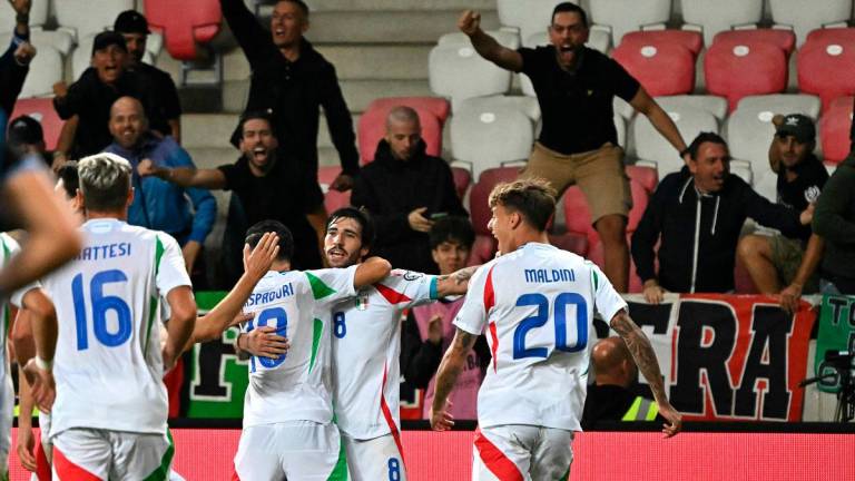 Italy’s midfielder Sandro Tonali celebrates with team mates after scoring the 4-5 winning goal during the 2026 World Cup qualifiers Europe zone group I football match between Israel and Italy on September 8, 2025 in Debrecen, Hungary. - Attila KISBENEDEK / AFP
