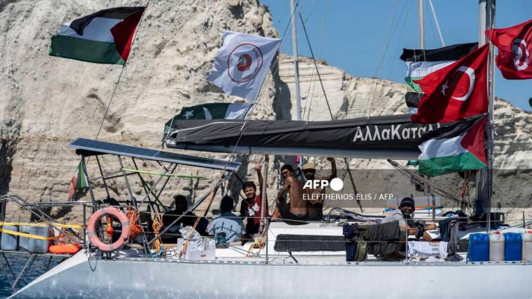 Members of the group of ships of the Global Sumud Flotilla to Gaza are seen moored at the small island of Koufonisi, south of the island of Crete, on September 26, 2025. (Photo by Eleftherios ELIS / AFP)