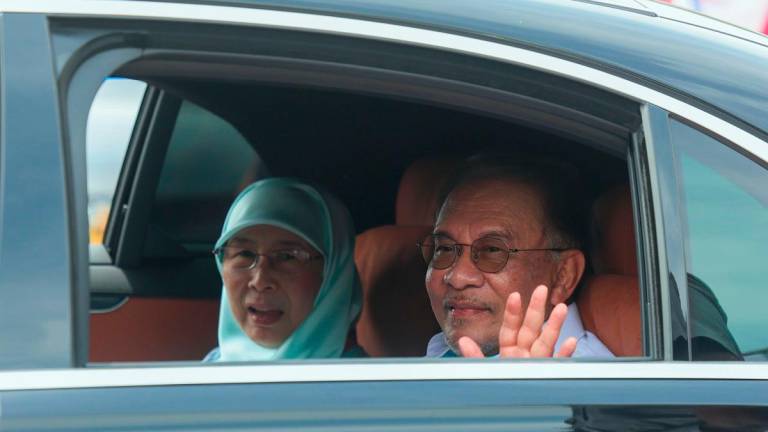 Prime Minister Datuk Seri Anwar Ibrahim and his wife Datuk Seri Dr Wan Azizah Wan Ismail. - BERNAMApix