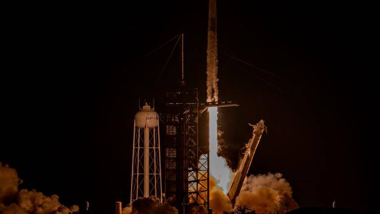 A SpaceX Falcon 9 rocket and Dragon spacecraft lifts off at Launch Complex 39A at NASA Kennedy Space Center before the launch of Axiom Space Axiom Mission on June 25, 2025, in Cape Canaveral, Florida. - Miguel J. Rodriguez Carrillo/Getty Images/AFP