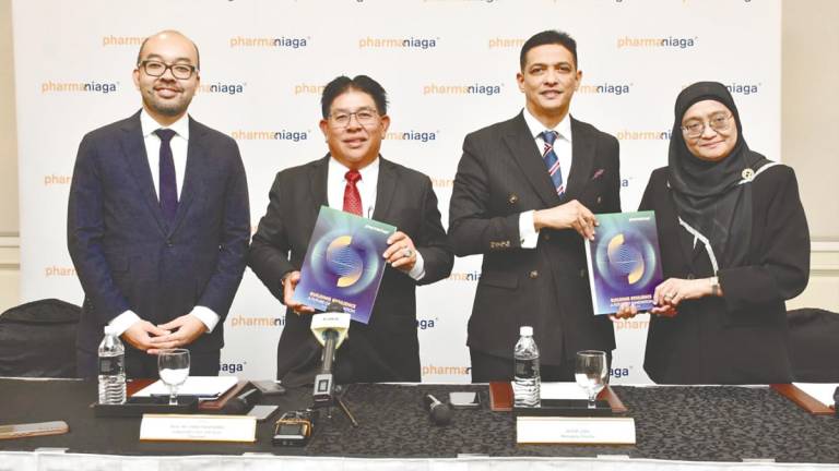 From left: Pharmaniaga COO Ahmad Shahredzuan Mohamed Shariff, chairman Datuk Seri Abdul Razak Jaafar, Zulkifli and CFO Noraini Mohamed Ali at a press conference after the company’s AGM.