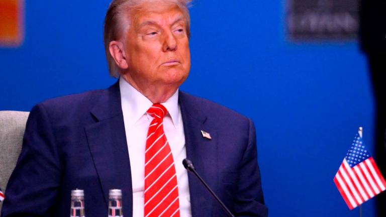 US President Donald Trump looks on at the start of a NATO leaders summit in The Hague, Netherlands June 25, 2025. - JOHN THYS / AFP