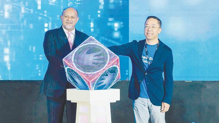 Gobind (left) and CTOS Digital Bhd Group interim CEO Kevin Loh at the launch of CTOS SME Biz Day 2025.