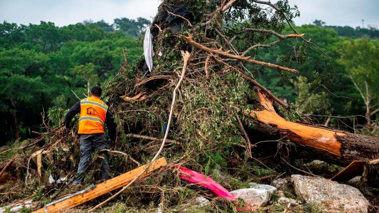 A volunteer rescue worker works after deadly flooding in Kerr County, Texas, U.S., July 5, 2025. - REUTERS/Sergio Flores