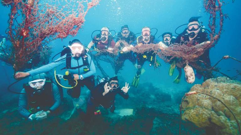 Nestle Malaysia volunteers, UMT and APMM removed ghost nets from the ocean floor to help restore marine habitats and protect coral reefs from damage.