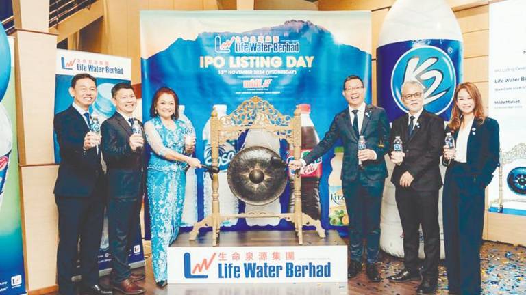 From left: Life Water senior director Tan Hwong Kuen, senior executive director Lim Young Piau, executive director Chin Lee Ling, Liaw, chairman Datuk Petrus Gimbad, and financial controller Christina Yap at the listing ceremony.