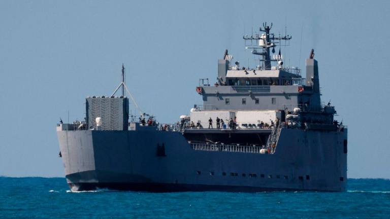 An Israeli navy vessel approaches Ashdod Port, carrying people detained by Israel from the Global Sumud Flotilla trying to deliver aid to Gaza, in southern Israel, October 2, 2025. REUTERS/Ammar Awad