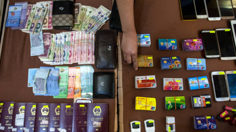 Cops bust 'Macau Scam' syndicate with arrest of ten
