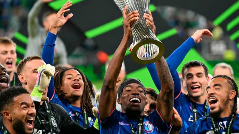 Chelsea’s English midfielder #11 Noni Madueke lifts the trophy as Chelsea’s players celebrate after the UEFA Conference League final football match between Real Betis and Chelsea FC in Wroclaw on May 28, 2025. AFPpix