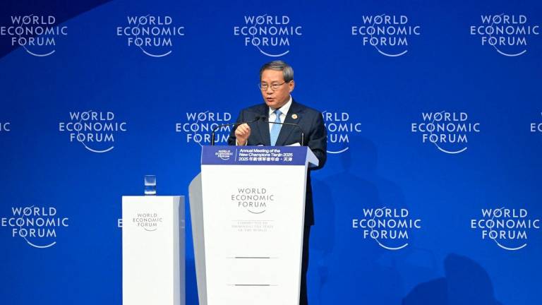 Chinese Premier Li Qiang delivers a speech during opening ceremony of the World Economic Forum Annual Meeting of the New Champions (AMNC25) in Tianjin on June 25, 2025. - Jade Gao / AFP