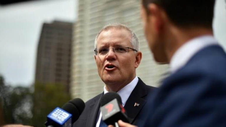 Australia PM rules out early poll after by-election blow