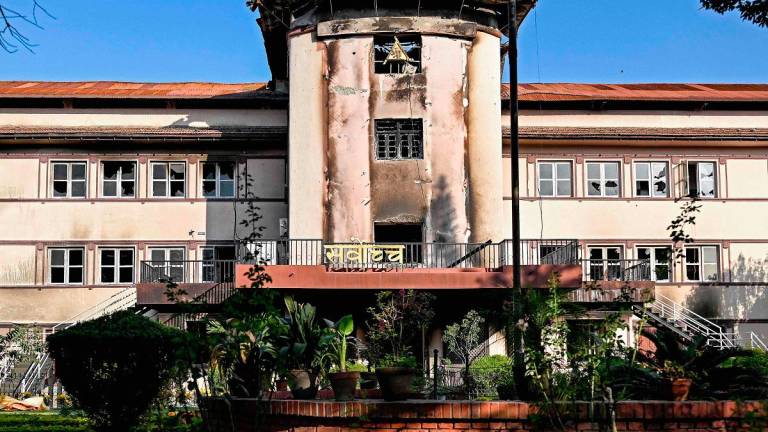 A general view shows the fire-damaged Supreme Court building in Kathmandu on October 15, 2025. - Prakash MATHEMA / AFP