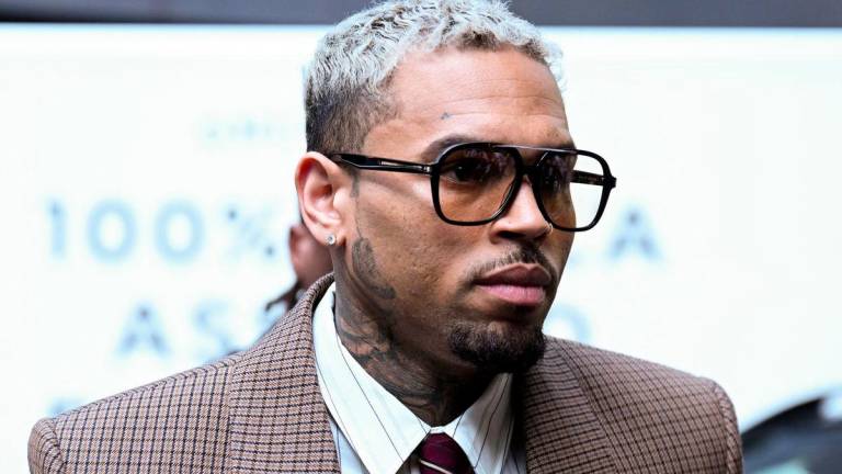 U.S. singer Chris Brown, who has been charged with inflicting grievous bodily harm in what prosecutors said was an unprovoked attack on a music producer at the Tape nightclub in central London in 2023, walks outside the Southwark Crown Court in London, Britain, July 11, 2025. - REUTERSPIX