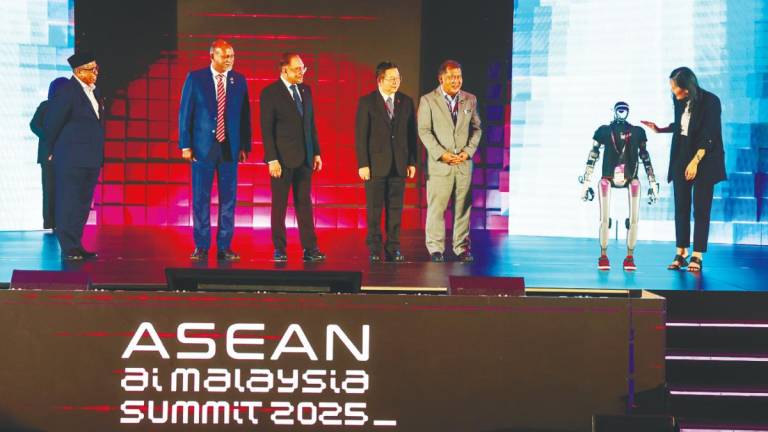 Prime Minister Datuk Seri Anwar Ibrahim (third left) officiates the Asean AI Malaysia Summit 2025 at the Malaysia International Trade and Exhibition Centre in Lumpur, today. Also present are Gobind (second left), Chief Secretary to the Government Tan Sri Shamsul Azri Abu Bakar (left), and Asean Secretary-General Dr. Kao Kim Hourn (third right). – Bernamapic