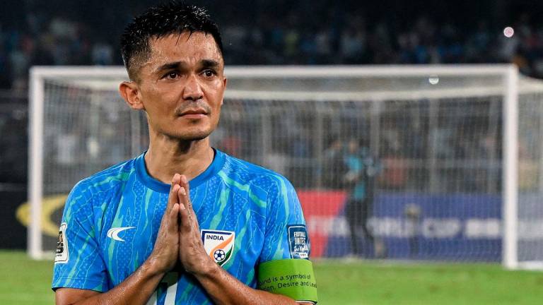 (FILES) India’s captain Sunil Chhetri greets his fans at the end of the FIFA World Cup 2026 Asia qualifier match between India and Kuwait at the Salt Lake Stadium in Kolkata on June 6, 2024. - DIBYANGSHU SARKAR / AFP