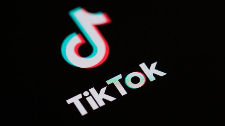 (FILES) Logo of the social network application Tik Tok on the screen of a phone. - Martin BUREAU / AFP