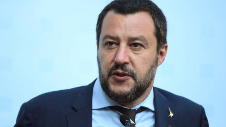 Italy's Salvini refuses to let migrants on coastguard ship disembark