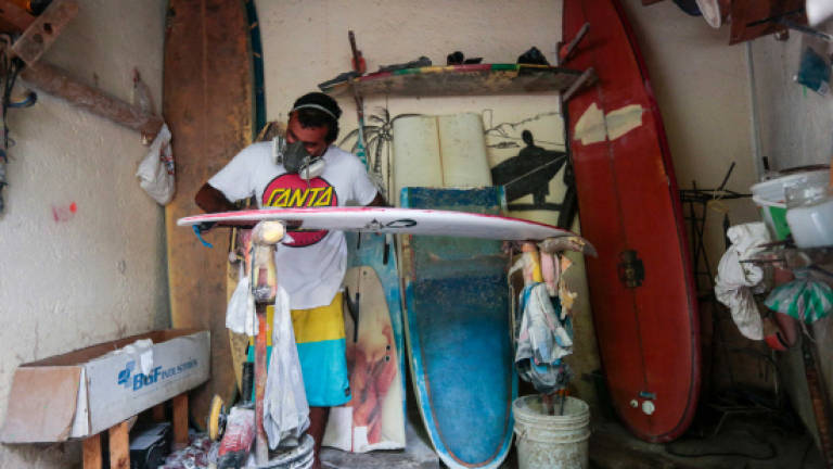 Acapulco's surfers seek to escape crime wave