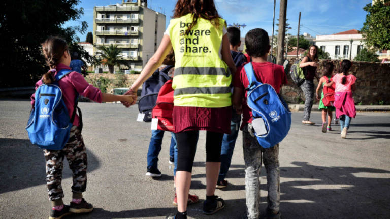On Greek islands, children of war hungry for school