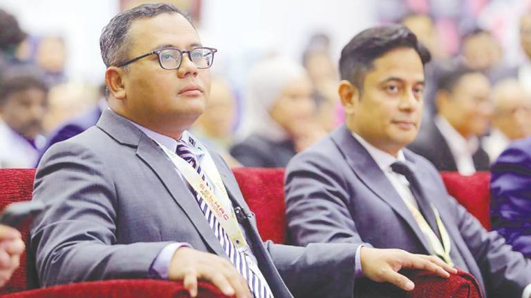 Amirudin (left) and Fahmi at the Selangor International Halal Convention.