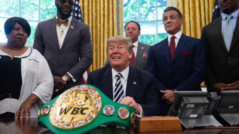 Trump pardons boxer Jack Johnson, first black heavyweight champ