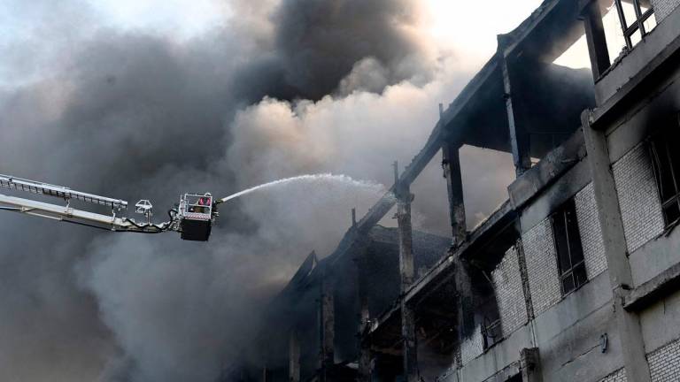 A firefighter extinguishes a fire at a civilian plant following Russian powerful attacks on the Ukrainian city of Kharkiv early on June 7, 2025. AFPpix