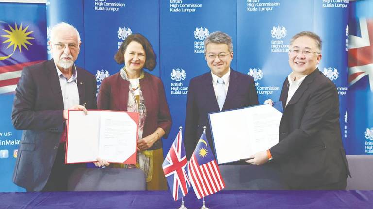 From left: Semiwise Ltd CEO Prof Asen Asenov, Wise, Liew and Chin at the MoU exchange ceremony today. – Bernamapic