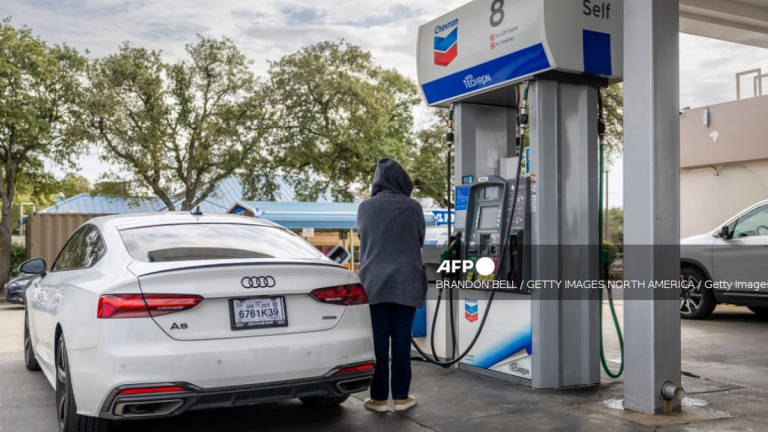 A customer pumps gas at a Chevron gas station on February 13, 2025 in Austin, Texas. - Getty Images via AFP