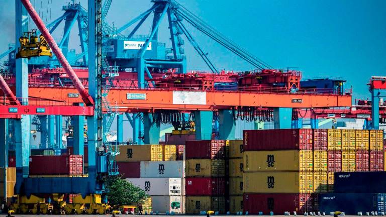 Stacks of cargo containers are kept at the Jakarta International Container Terminal in Tanjung Priok Port, Jakarta on July 7, 2025. - Bay ISMOYO / AFP