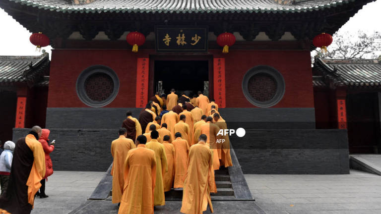 In this photo taken on January 28, 2017, Chinese monks attend a ceremony at a Shaolin Temple, the birthplace of Chinese Buddhism, to celebrate the Lunar New Year in Dengfeng, Henan province. - AFP
