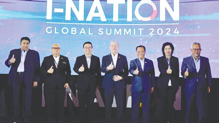 Deputy Prime Minister Datuk Seri Fadillah Yusof (centre) and Chang (third from left) with other dignitaries at the launch of i-Nation Global Summit 2024 today. – Bernamapic