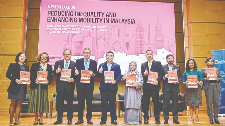 From left: World Bank senior economist Dr Laura Rodriguez, country manager for Malaysia Judith Green, poverty and equity global director Dr Luis Felipe Lopez-Calva, country director for Philippines, Malaysia &amp; Brunei Dr Zafer Mustafaoglu, Rafizi, Economy Ministry deputy secretary-general (policy) Datuk Dr Zunika Mohamed, World Bank executive director for Southeast Asia Wempi Saputra, Chief Statistician Malaysia Datuk Seri Dr Mohd Uzir Mahidin, World Bank senior economist Ririn Salwa Purnamasari and practice manager Benu Bidani at the launch of the World Bank and Ministry of Economy joint report. – Bernamapic