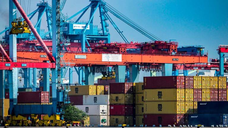 Stacks of cargo containers are kept at the Jakarta International Container Terminal in Tanjung Priok Port, Jakarta on July 7, 2025. - Bay ISMOYO / AFP